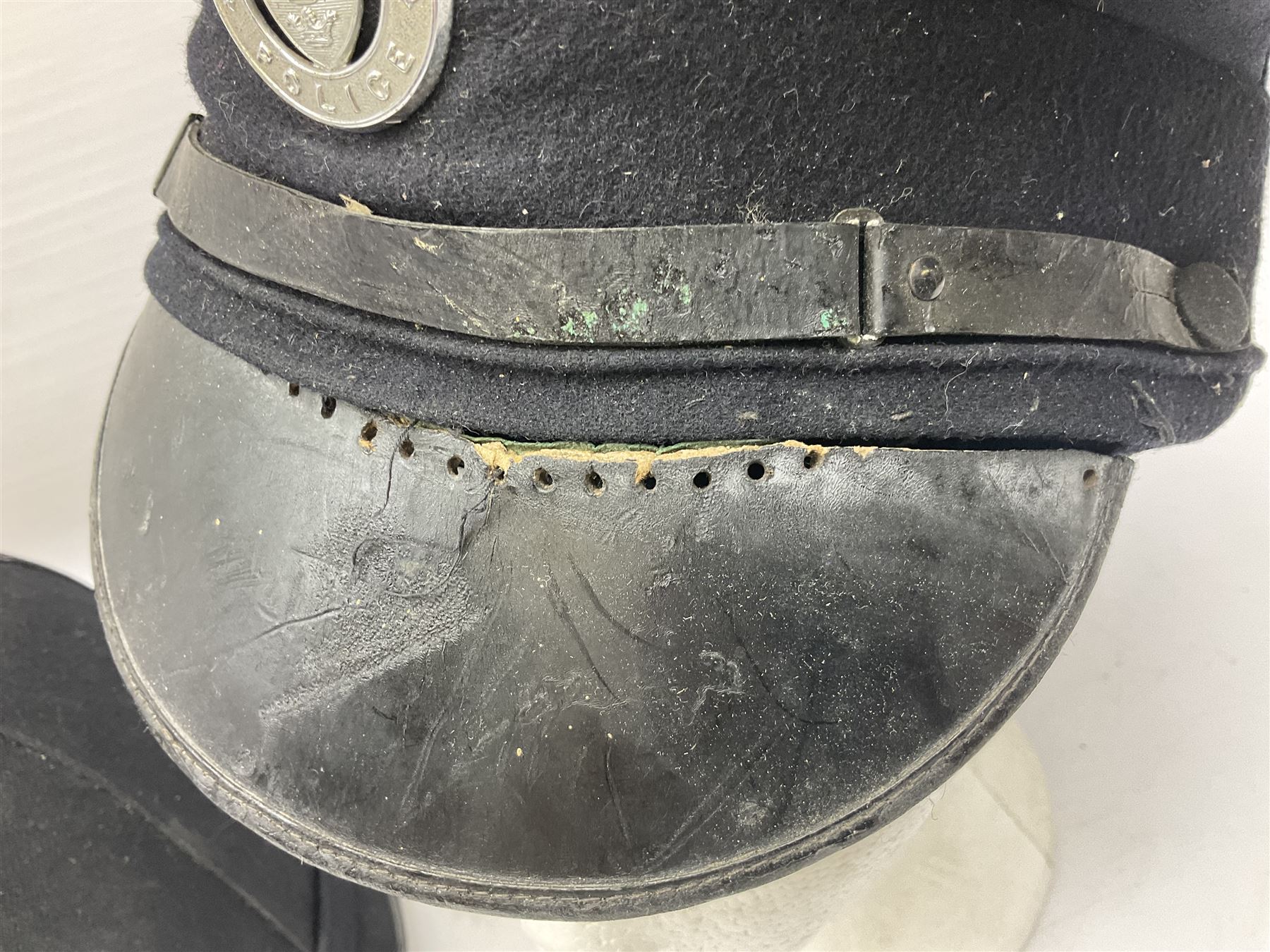 Hull City Police - helmet with king's crown night plate; two further ball-top helmets with Queen's crown plates; and a peaked cap (4)