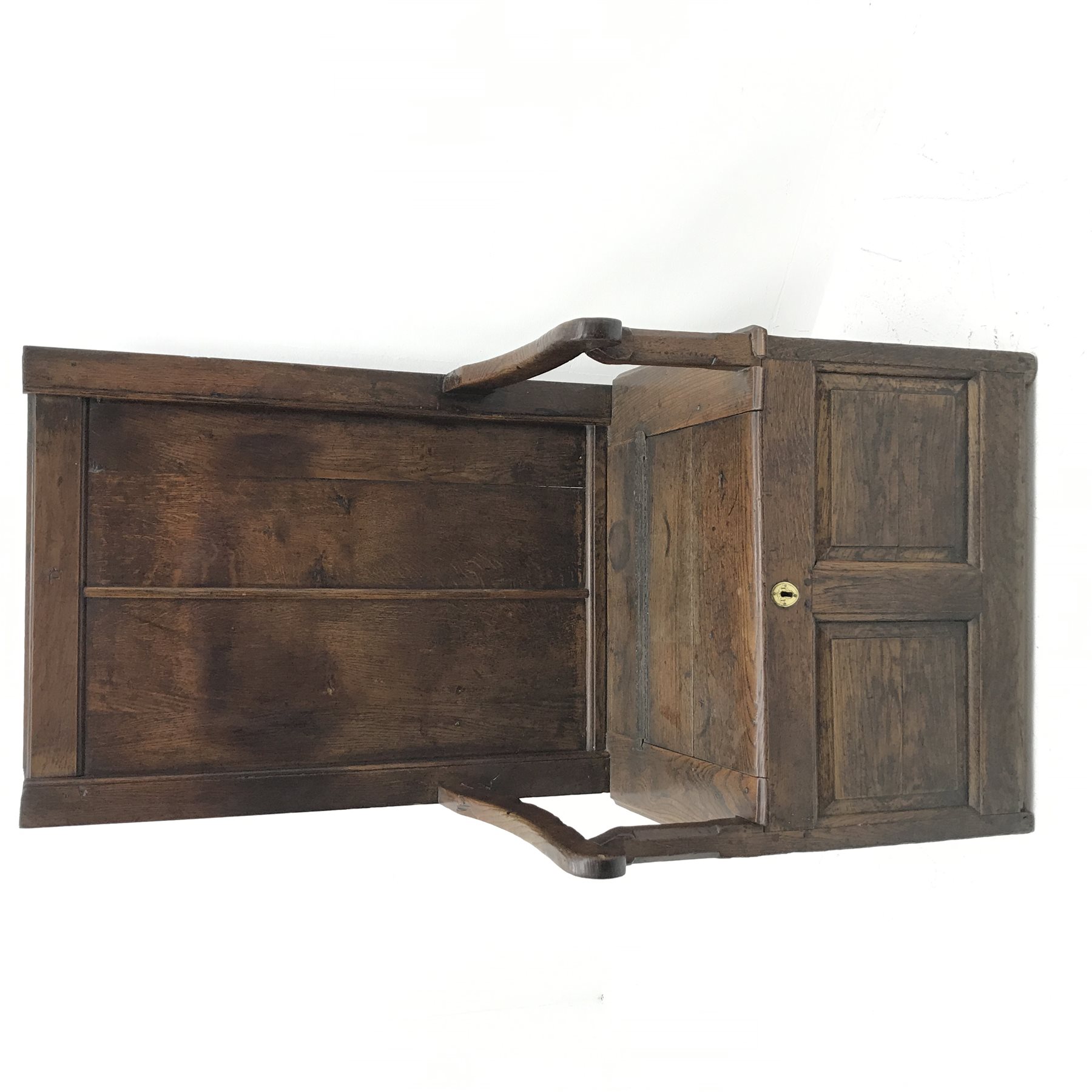 18th century oak box seat settle, panelled back, cresting rail initialled 'T.I', the moulded seat with hinged lid, down swept arms on octagonal faceted supports, fielded panelled base, engraved brass escutcheon initialled again 'T.I', W80cm, H149cm, D59cm