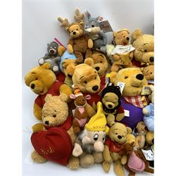 Over fifty Walt Disney character soft toys including various Pooh bears, Goofy, Tigger, Snow White Dwarfs, Pinocchio, Jungle Book, Lion King etc