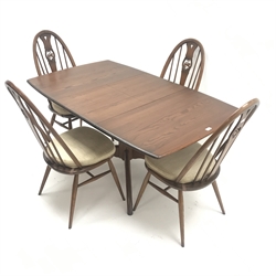  Ercol Windsor dark elm extending pedestal dining table, turned column on four supports (W149cm extended, W104cm closed, H73cm, D90cm) and four swan back chairs, turned supports joined by stretchers (W45cm)  