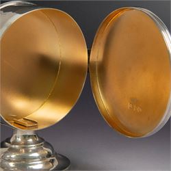 Late Victorian silver lunette, of plain circular form with hinged cover opening to reveal gilt interior, upon a circular domed foot, hallmarked Lambert & Co, London 1897, H13cm