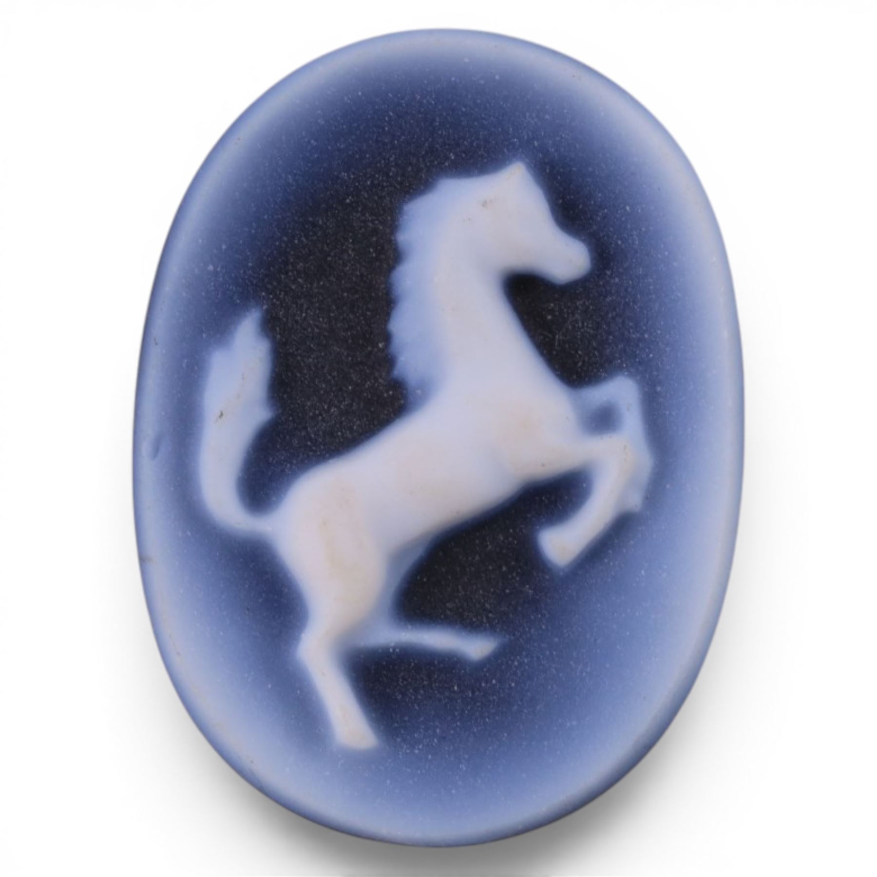 Hand cut blue agate cameo depicting a rearing horse, H1.5cm