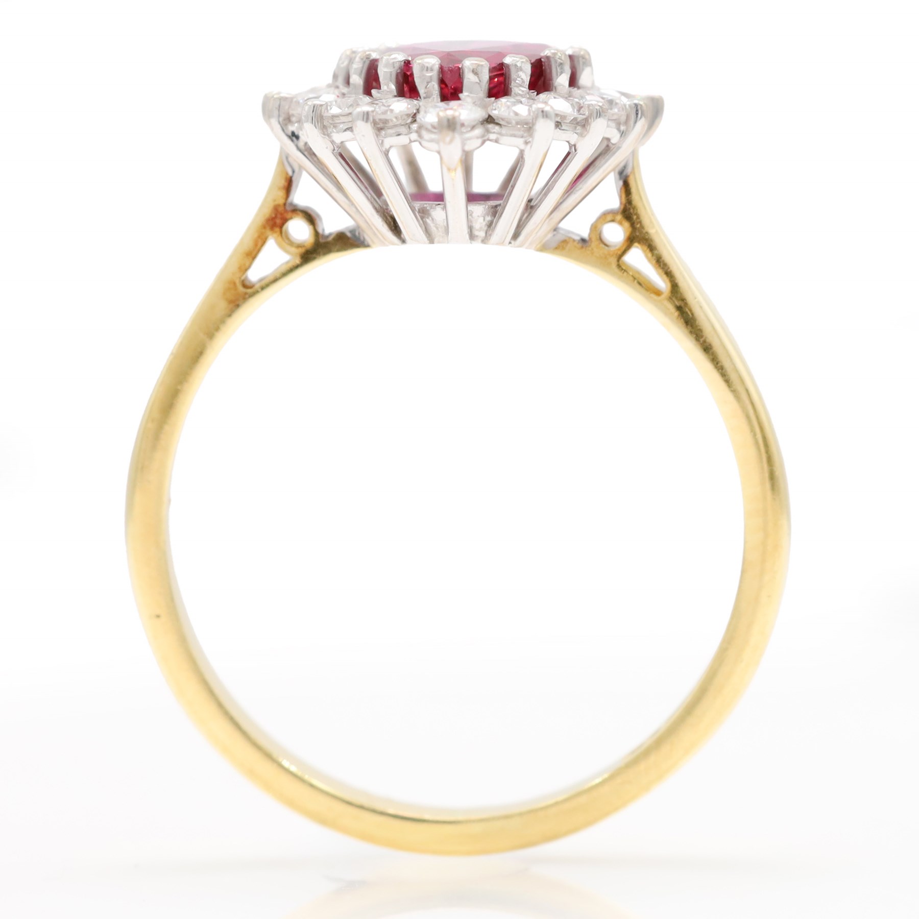 18ct gold ruby and diamond cluster ring, single pear cut ruby of approx 1.05 carat, surrounded by fourteen round brilliant cut diamonds, Birmingham 1988, total diamond weight approx 0.40 carat