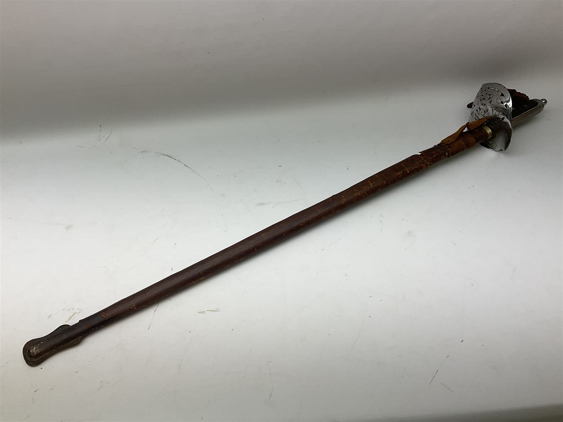 British George V 1897 Pattern Infantry Officers Sword, the 82.5cm fullered steel blade etched and polished with crowned royal arms, GRV cyphers and scrolling foliage, marked Army & Navy Co-operative Society 105 Victoria St London SW to the ricasso,  plated pierced basket hilt with wire bound fish skin grip and leather knot, No.15032; in leather covered scabbard