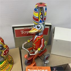 Twenty six tinplate models to include Ferris Wheel and Performing Circus Elephant, marked JW, further similar examples such as Duck on a Bike, Clown on Roller, Carousel; Popeye Tin Speedboat; Looney Tunes Wind Up Cars and Express Train; various international examples, MS107 Jumping Bambi, Pop Pop Boat, jumping frogs, pecking chickens etc; both boxed and loose