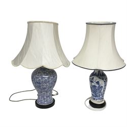 Two blue and white ceramic table lamps of baluster form, both with fabric shades, tallest H35cm excl fitting