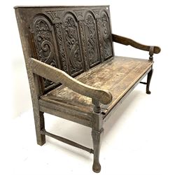 Victorian oak settle, four panel back with floral carvings, cabriole legs, solid seat