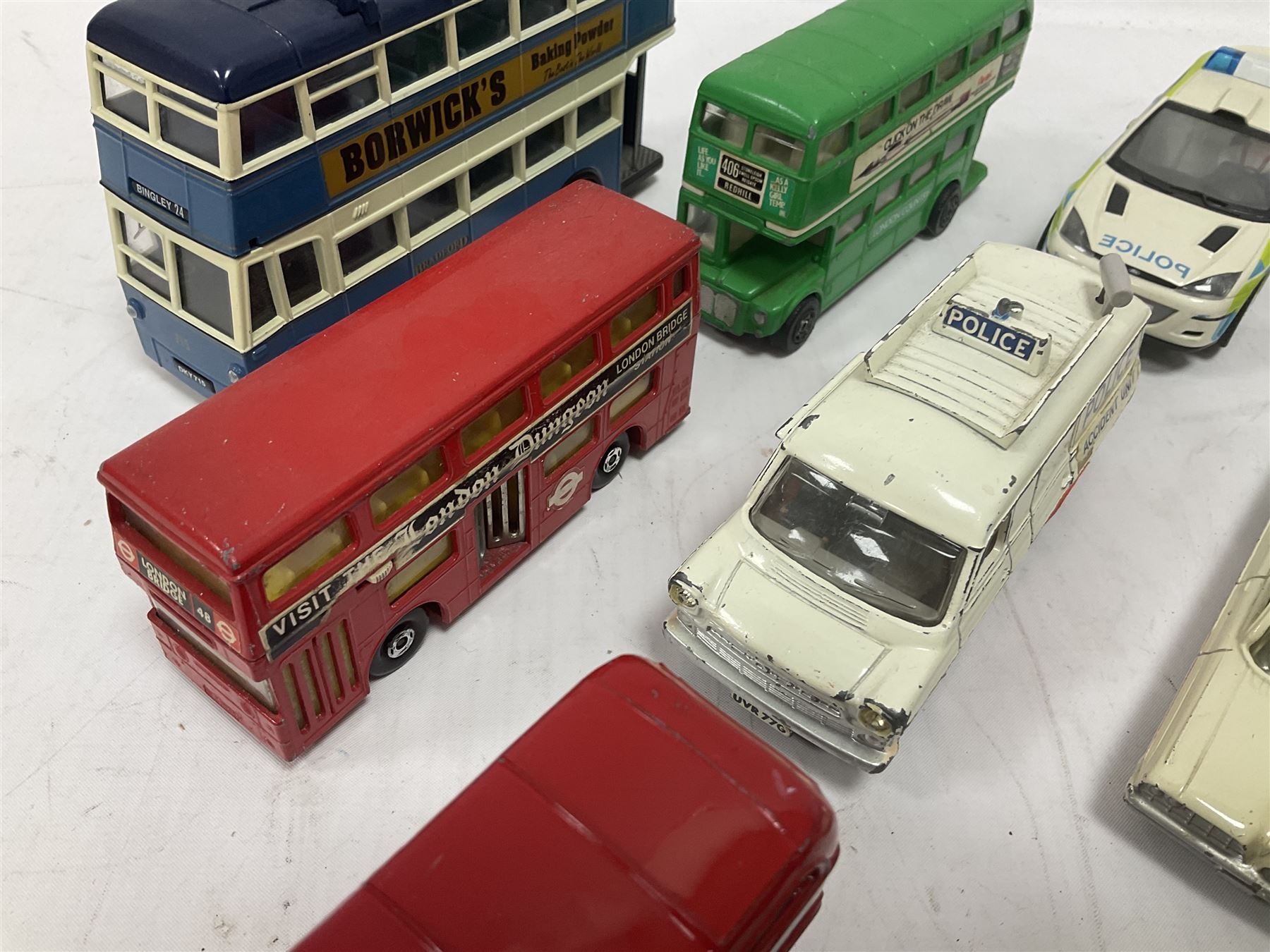 Corgi/Dinky - twenty-four unboxed and playworn die-cast models, predominantly emergency vehicles and buses; including Autocar Isobloc, Superior Criterion Ambulance, Ford Transit Police Vans, Chevrolet Impalas, Minissima, Ausin Mini Police van etc (24)