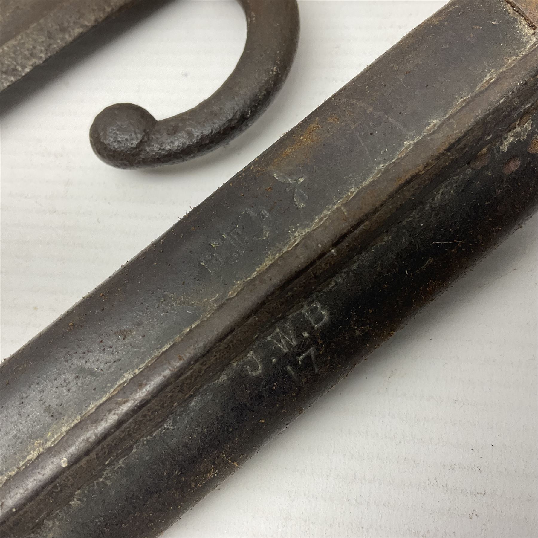 WWI Remington Pattern 1913 bayonet, the 43cm fullered blade with various marks to the ricasso including date code 11 16; in leather covered scabbard with various stamps including JWB 17 L58cm overall; and a French Model 1866 sabre bayonet (no scabbard)