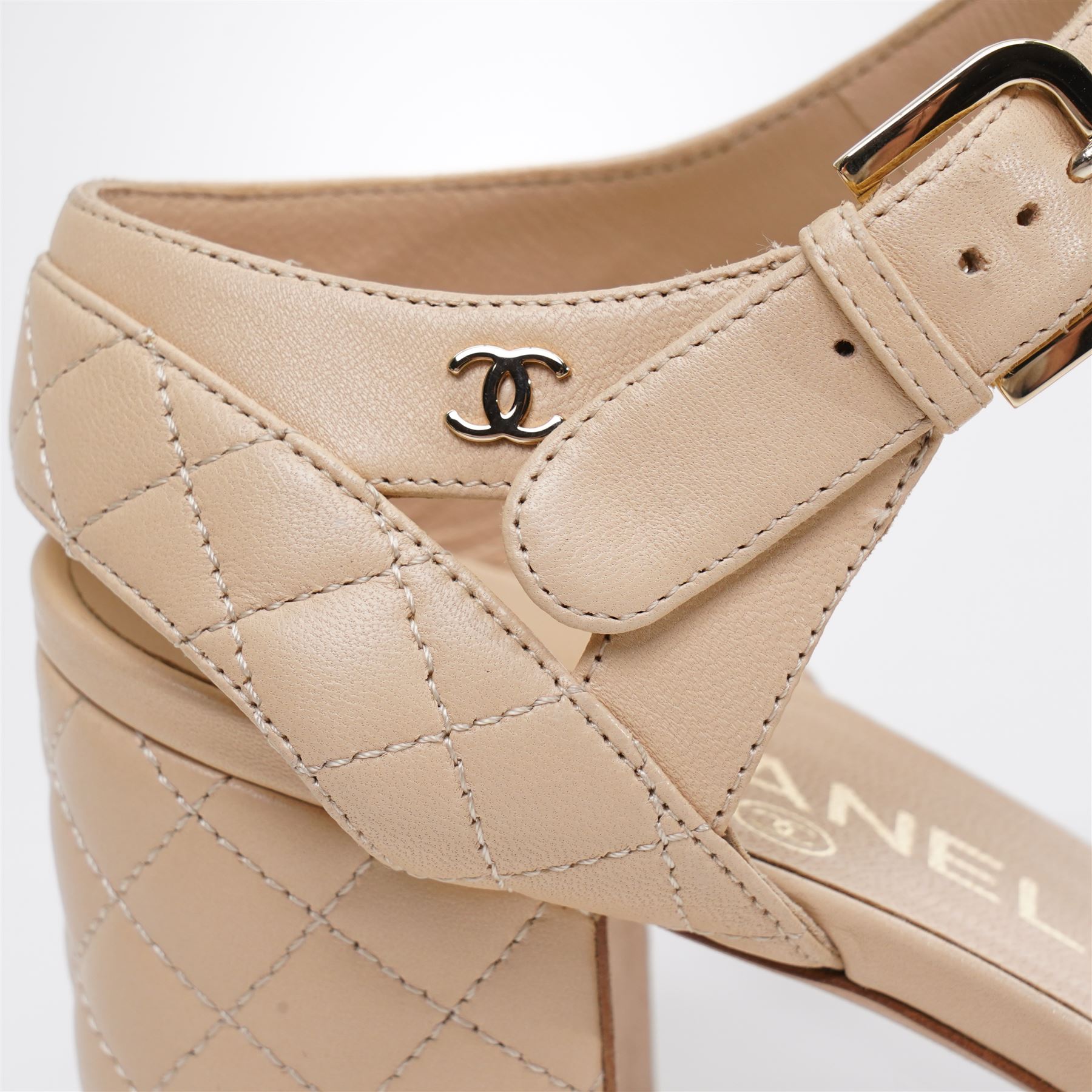 Chanel - pair of beige quilted leather heeled sandals, circa 2016, with stitched diamond pattern uppers, ankle straps with gold tone CC logo detail and hardware, with quilted block heels, size 37C, unused with original dust bags