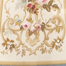 Aubusson flatwoven runner, cream field decorated with floral bouquets and scrolling foliate cartouche, within pale blue outer border and ochre guard bands