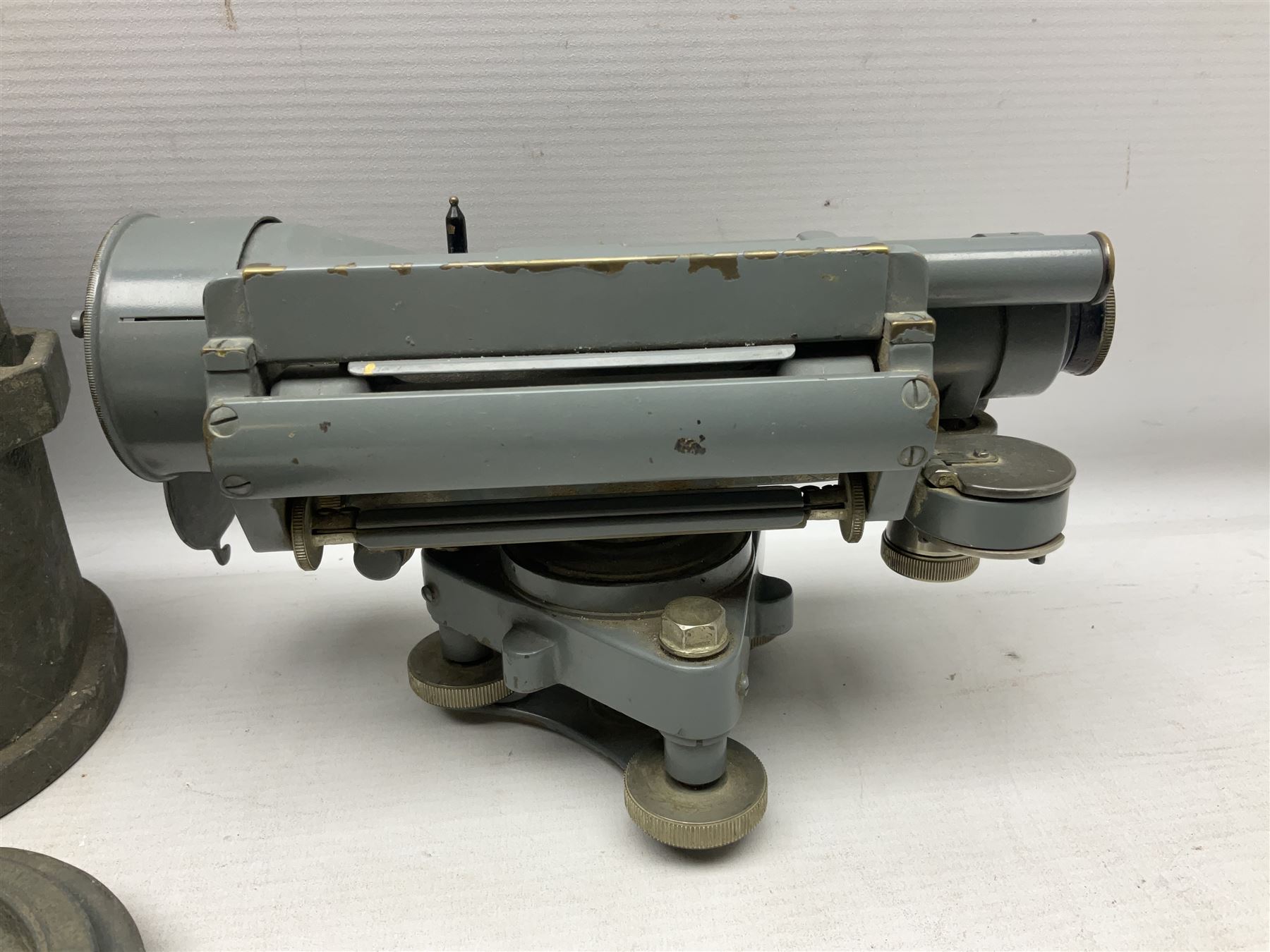 Cooke Troughton & Simms grey painted brass dumpy level in carrying case; and WW2 British .303 Vickers Machine Gun brass Clinometer, stamped 'V.E. 0067' serial No. 2370,  dated 1944 unboxed (2)