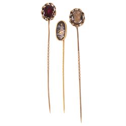 9ct gold photo pendant and three gold plated stick pins, including one stone set and one hairwork example