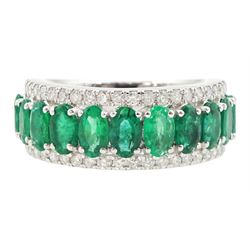 Platinum three row emerald and diamond half eternity ring, eleven oval cut emeralds with a row of round brilliant cut diamonds either side, hallmarked, total emerald weight approx 2.50 carat, total diamond weight approx 0.45 carat
