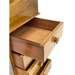 Fine and unusual 19th century olivewood piano top davenport, raised shaped back carved with olive branches and olives, the top hinges to reveal lidded and correspondence compartments, the piano lid enclosing sliding top with hinged and adjustable writing surface with leather inset, right-hand panelled door enclosing four drawers, olive branch and scroll carved cabriole front supports on moulded and shaped platform, turned cup feet with recessed castors 