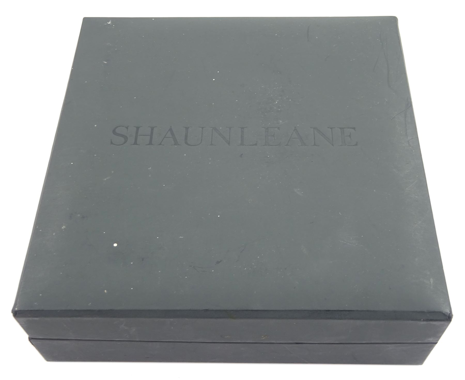 Shaun Leane silver and red topaz ivory resin Tusk bangle, one other black Tusk bangle, both hallmarked and a silver-gilt bone bead wrap bracelet, all by the same hand