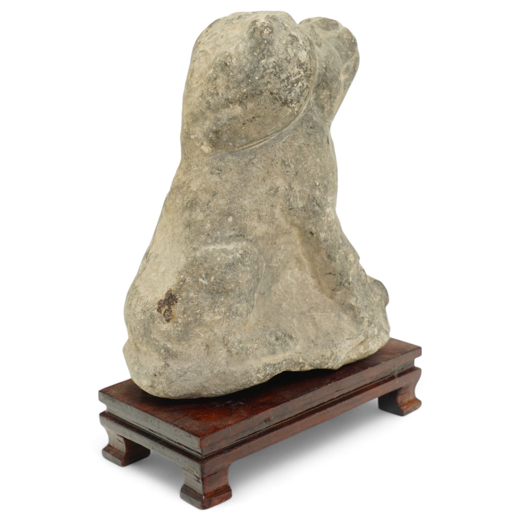 Chinese Western Han Dynasty (206BC–24AD) carved seated stone dog, stylized figure with upright ears and upraised squared snout, grey stone with weathered surface and tool marks visible to underside W13cm H16.5cm