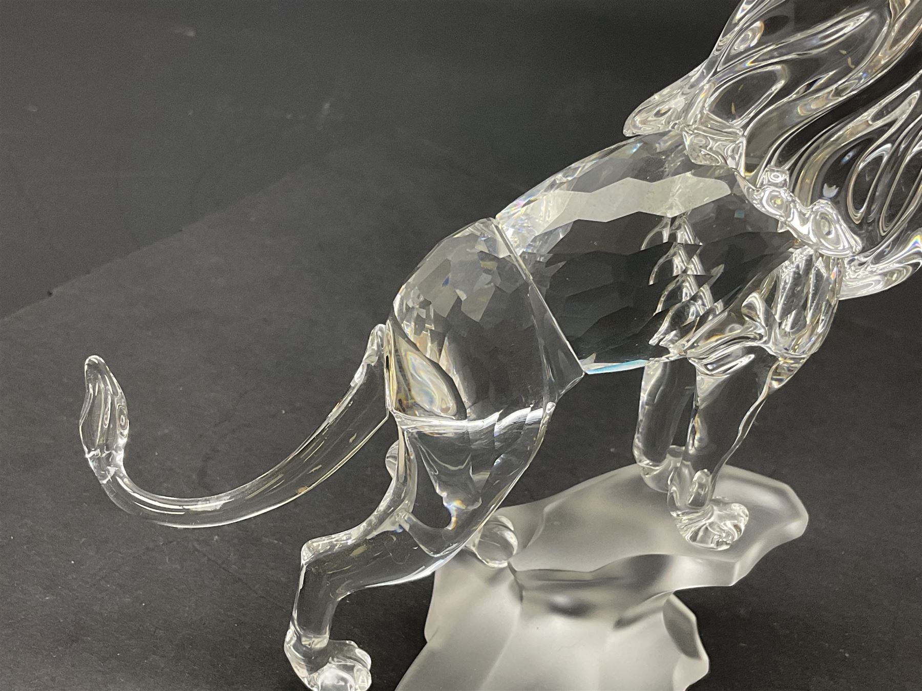 Swarovski Crystal animals, comprising camel and lion, both upon frosted crystal bases, together with Swarovski Crystal palm tree, upon similar frosted crystal base, tallest H14cm