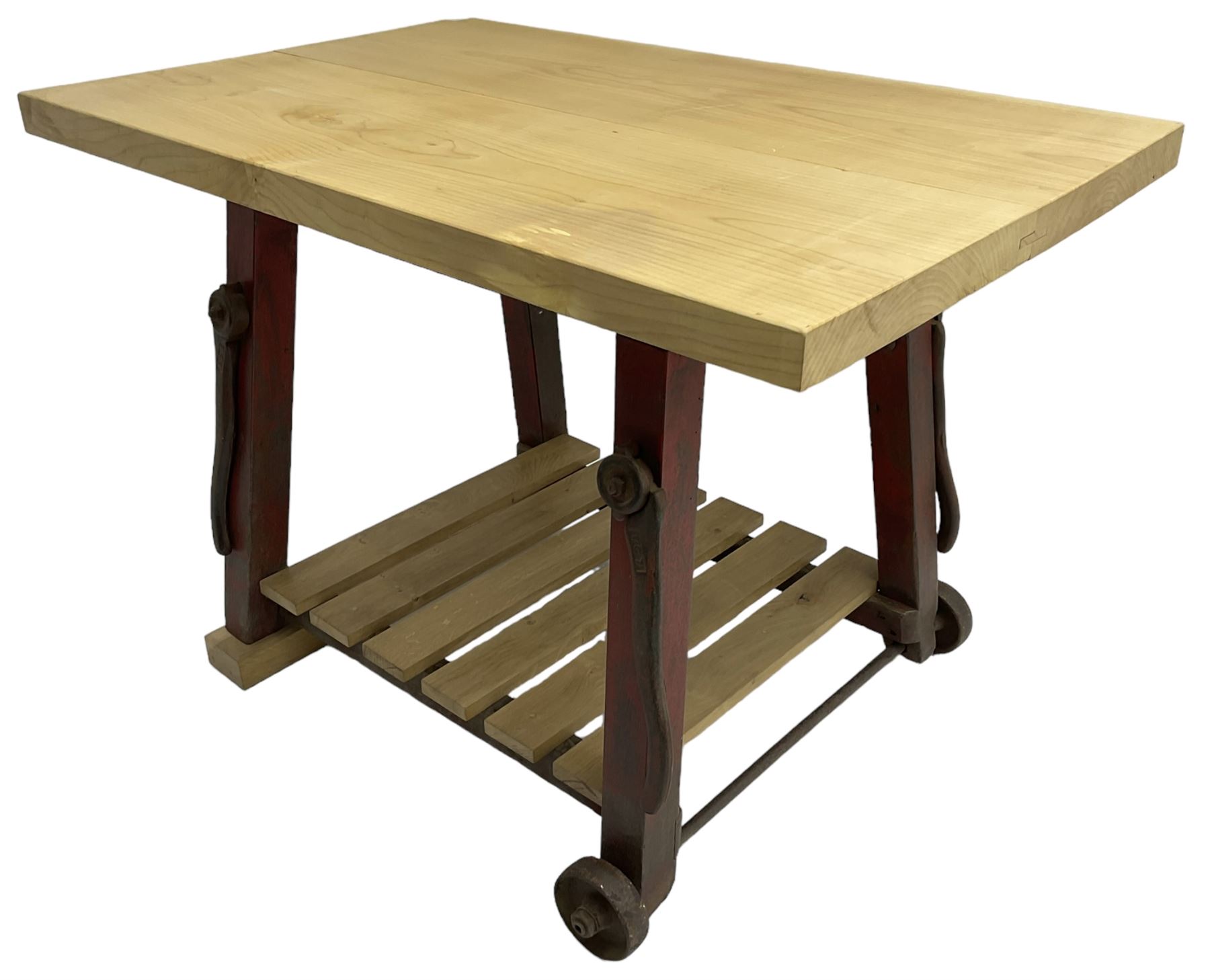 Kitchen island with rectangular maple top, on reclaimed machinery base with oak pot board, on block sledge feet