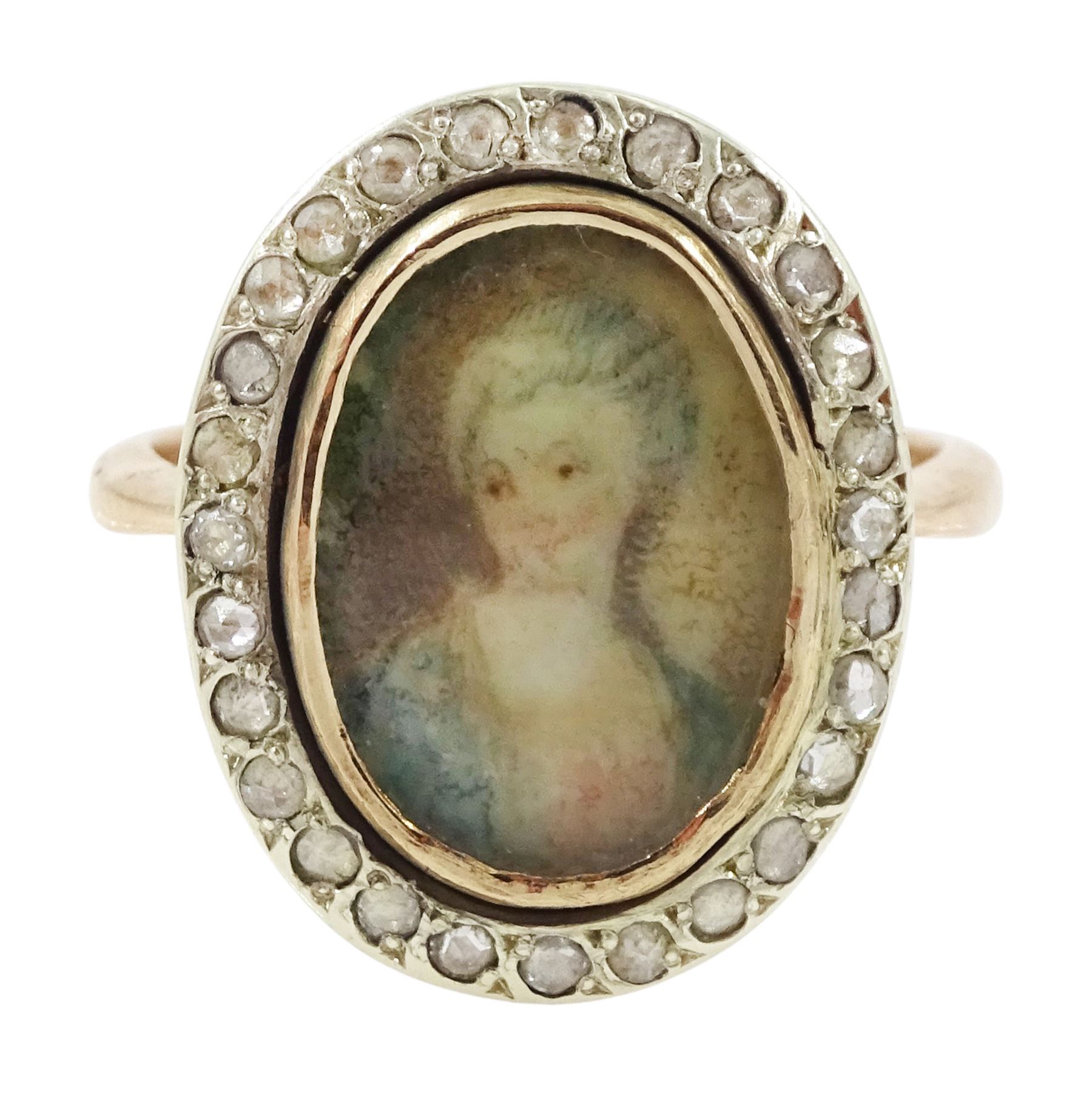 19th century 9ct gold diamond portrait ring, set with an oval miniature of a woman in 18th century dress on ivory, under a glazed panel, with rose cut diamond surround, on later shank. This lot has been registered for sale under Section 10 of the APHA Ivory Act