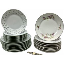Eight dinner and eight side plates by Thun with a leaf design, along with eight dinner plates with a floral design, along with a ladies wrist watch. 