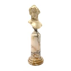 Louis Sosson (fl. 1905 - 1930), French carved ivory bust, modelled as Ariadne wife of Bacchus, or a Bacchante, signed verso L. Sosson, raised upon a marble column with socle top and stepped base, H27cm