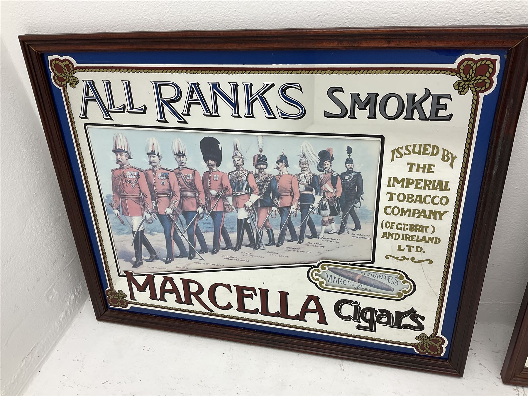 Four advertising mirrors, comprising of Southern Comfort, All Ranks smoke Marcella Cigars, Coca-Cola and Player's Navy Cut, largest example H70cm, L60.5cm