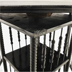 Edwardian black painted side table with incorporated revolving bookcase, supported on barley twist legs