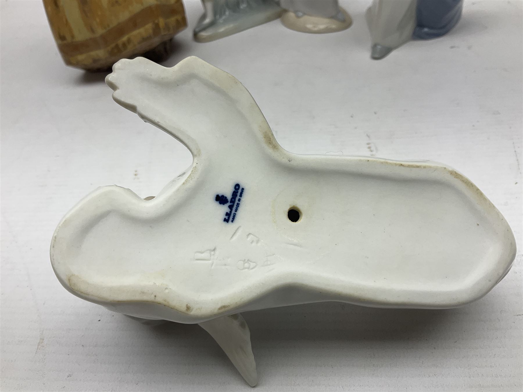 Four Lladro figures, including Girl With Cockerel no 4591, Gres Lonely no 2076 etc together with Nao figure 