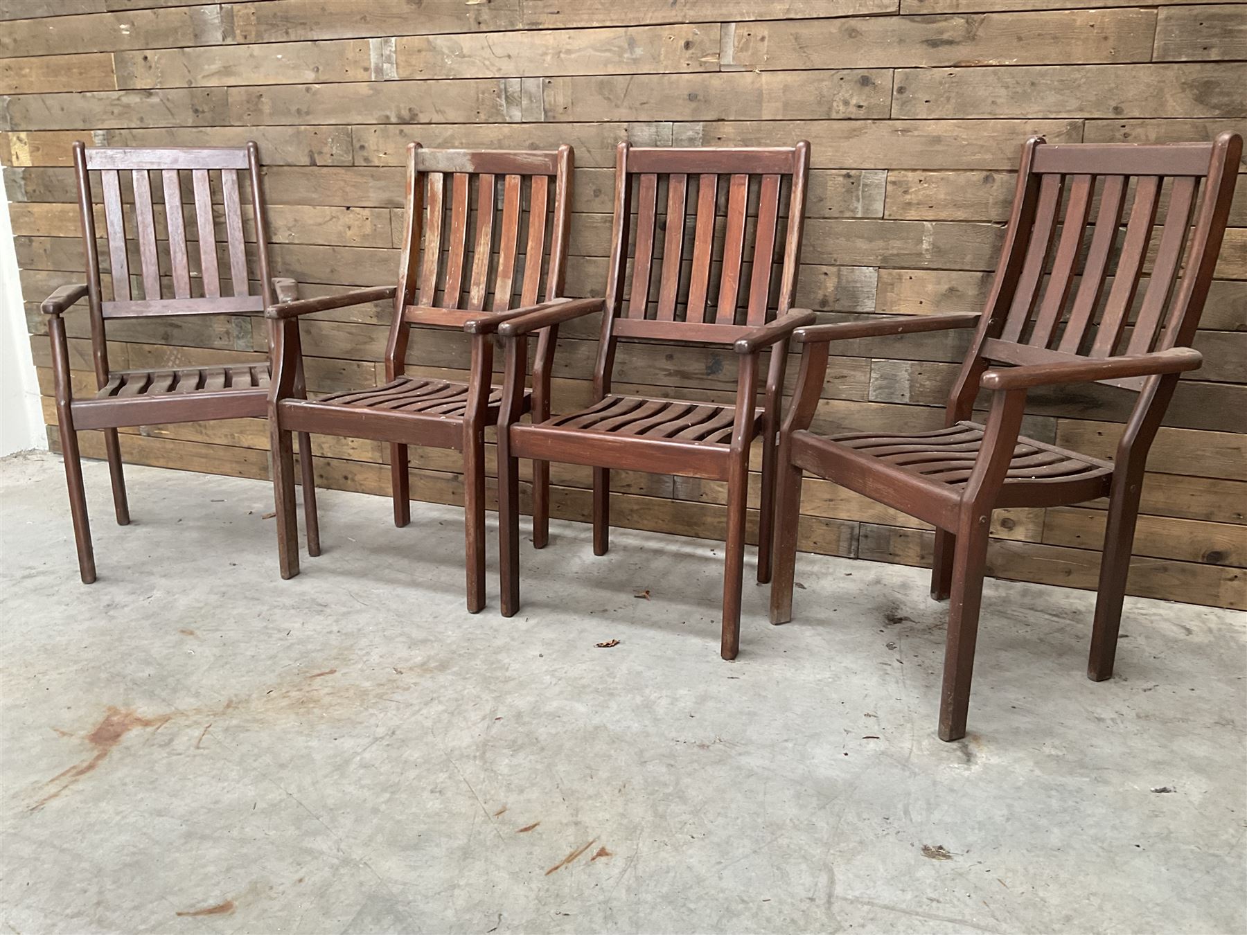 Set of eight hardwood garden armchairs
