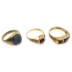  Two 9ct gold gentleman's garnet set rings and an onyx signet ring all hallmarked   