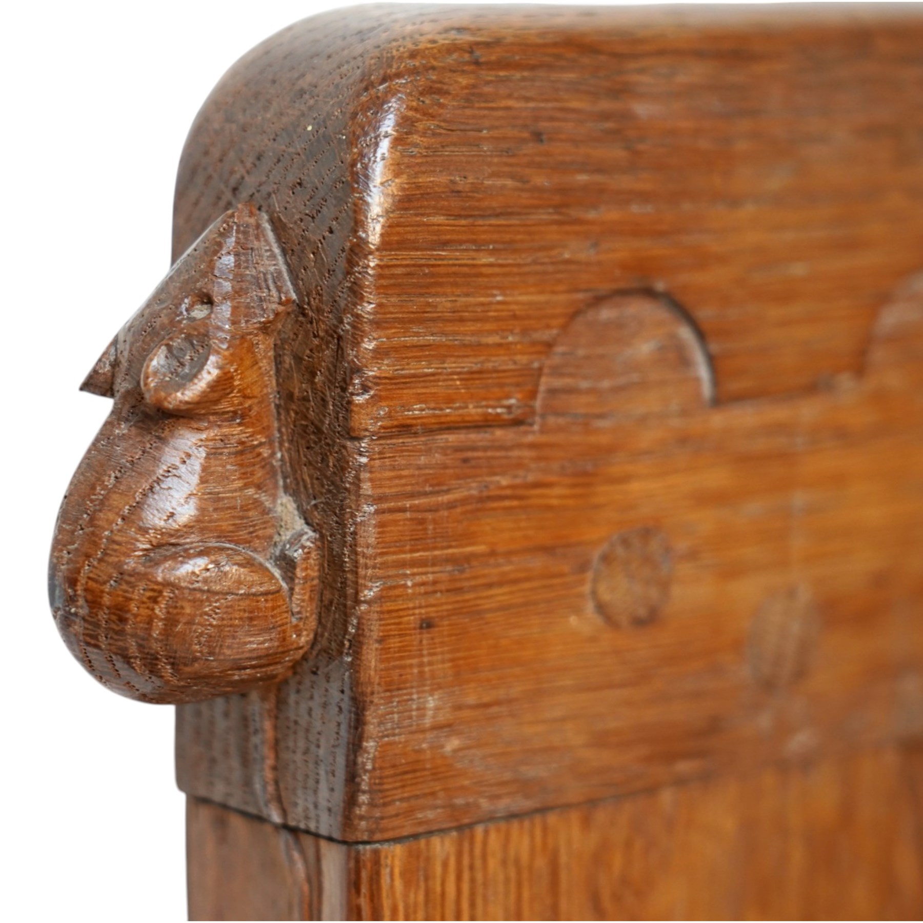 Mouseman - pair of 1930's adzed and panelled oak single beds, the head and foot-boards with arcade-carved cresting rails above adzed panels, with Vibase mattress supports, carved with mouse signature, by the workshop of Robert Thompson of Kilburn