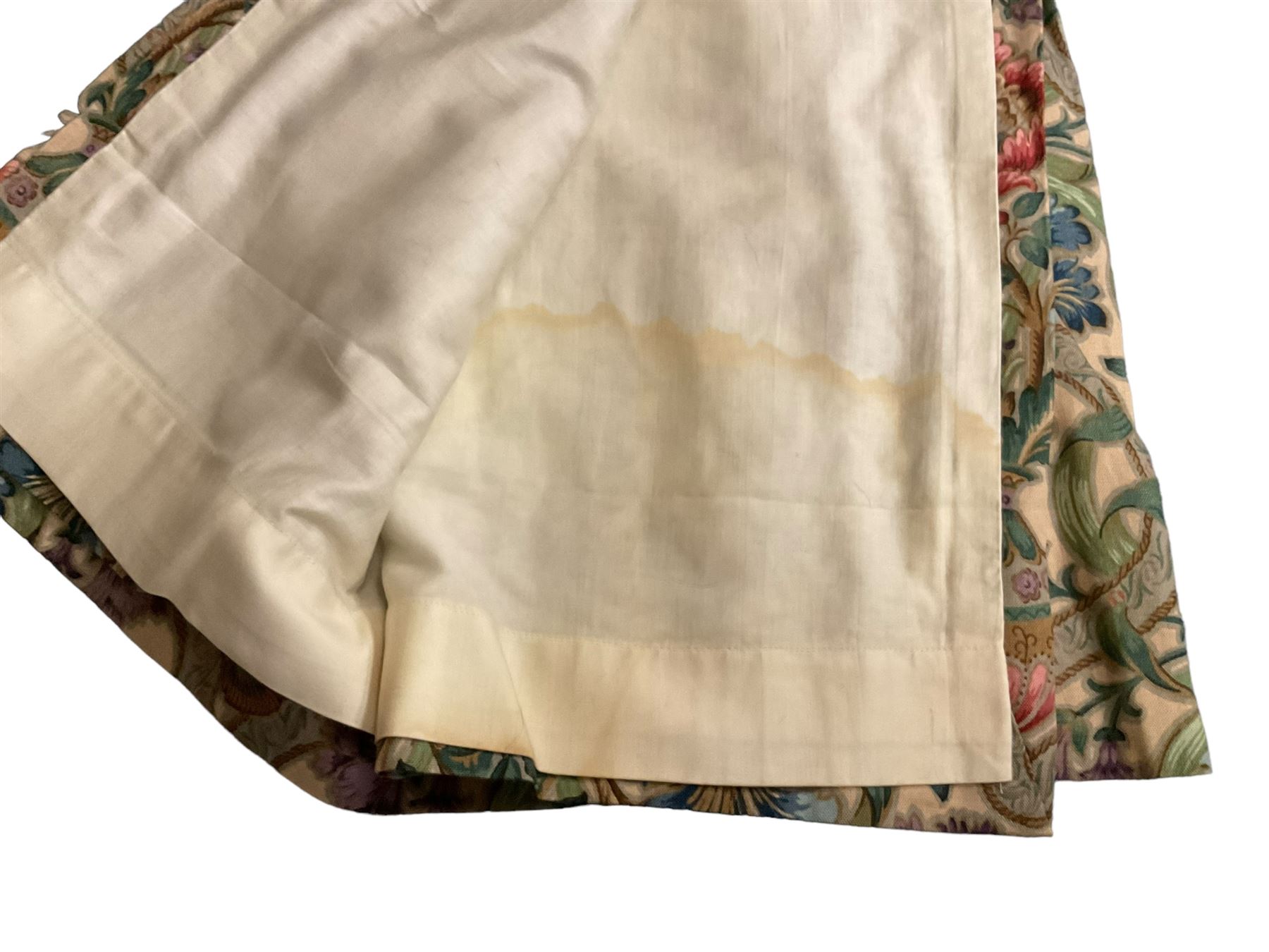 Two pairs of lined curtains, ivory ground fabric decorated with jardinieres of flowers spaced by scroll motifs, W329cm, fall 237cm (2)