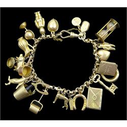 9ct gold link bracelet, with spring loaded clasp and twenty-two gold 9ct gold charms including teddy bear, pig, nut, Good luck envelope and horseshoe