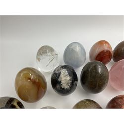 Collection of twenty-one hardstone specimen eggs, including labradorite, calcite, orbicular jasper, tiger's eye, smokey quartz, fossilised wood etc, originally part of the collection of the late Stanley J Seeger