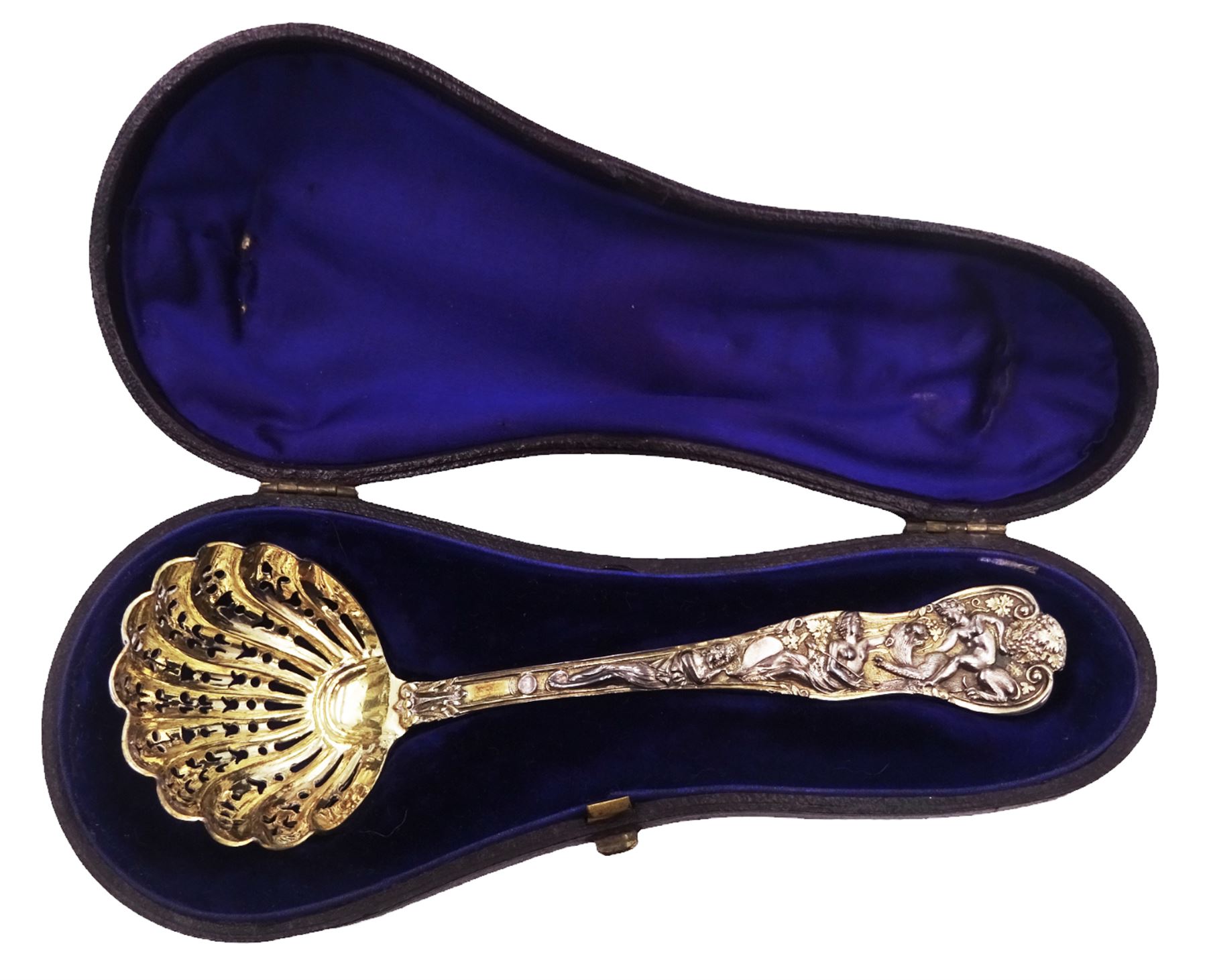 Victorian silver-gilt sugar sifting spoon, with gilded pierced shell shaped bowl, the handle decorated in relief with classical greek figures amongst fruiting vines, hallmarked Henry John Lias & James Wakely, London 1874,  L16cm, contained within tooled leather silk and velvet lined fitted case