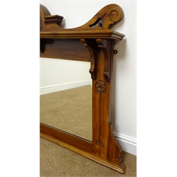  Edwardian Art Nouveau walnut overmantle mirror with top shelf and carved stylised motifs, W105cm, H86cm  