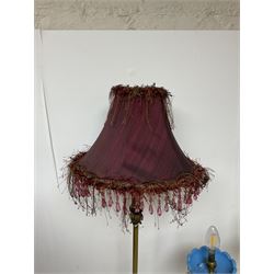 Brass table lamp, modelled as a candelabra with five branches, each with blue glass candle holders with crystal drops, H47cm, together with a pair of cast metal table lamps with acanthus leaf detail, upon a stepped square base, with red fabric feather and tassel shades, H78cm