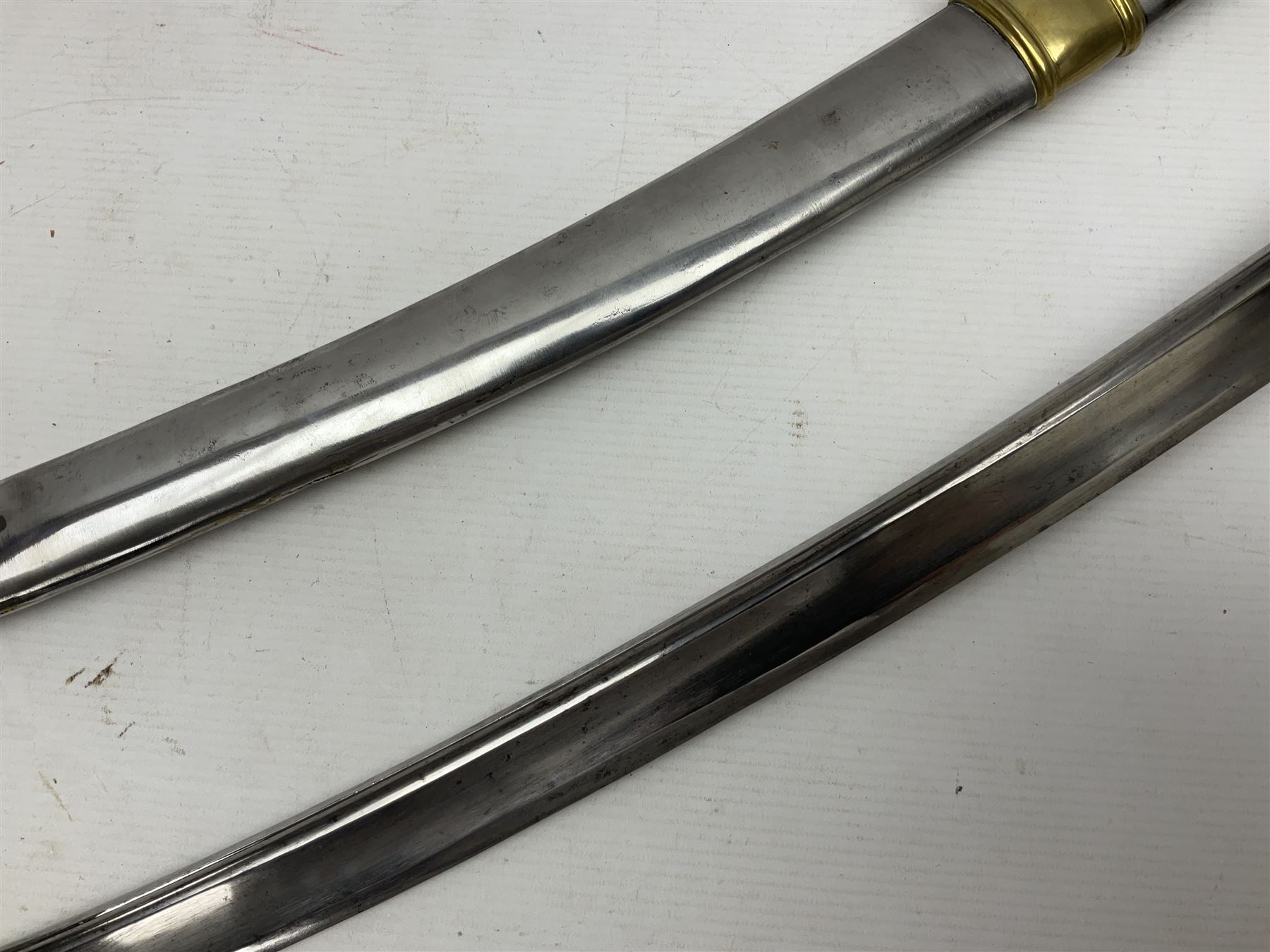 19th century French Chasseur a Cheval de la Guard trooper's sword with 86.5cm slightly curving fullered blade, brass three-bar hilt with elongated elliptical langets and wire-bound leather grip; in polished steel scabbard with two brass suspension rings L104cm overall