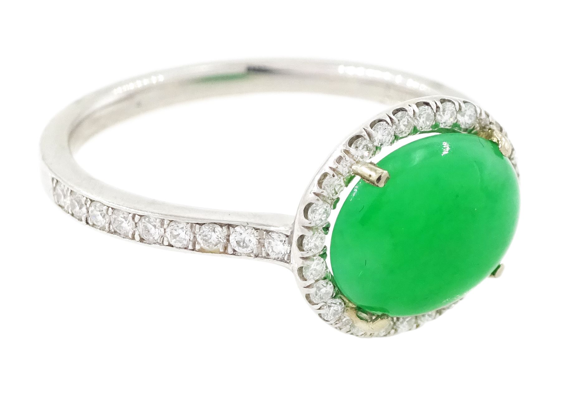 Platinum jadeite and diamond cluster ring, single oval cabochon cut jadeite of 2.20 carat, surrounded by round brilliant cut diamonds and diamond set shoulders, stamped Plat