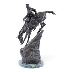 After Frederick Remington; The Mountain Man bronzed spelter figure of a native American trapper upon a marble base with plaque, H72cm