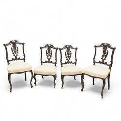 Two pairs of late Victorian carved rosewood dining chairs, pierced and foliate balloon bac...