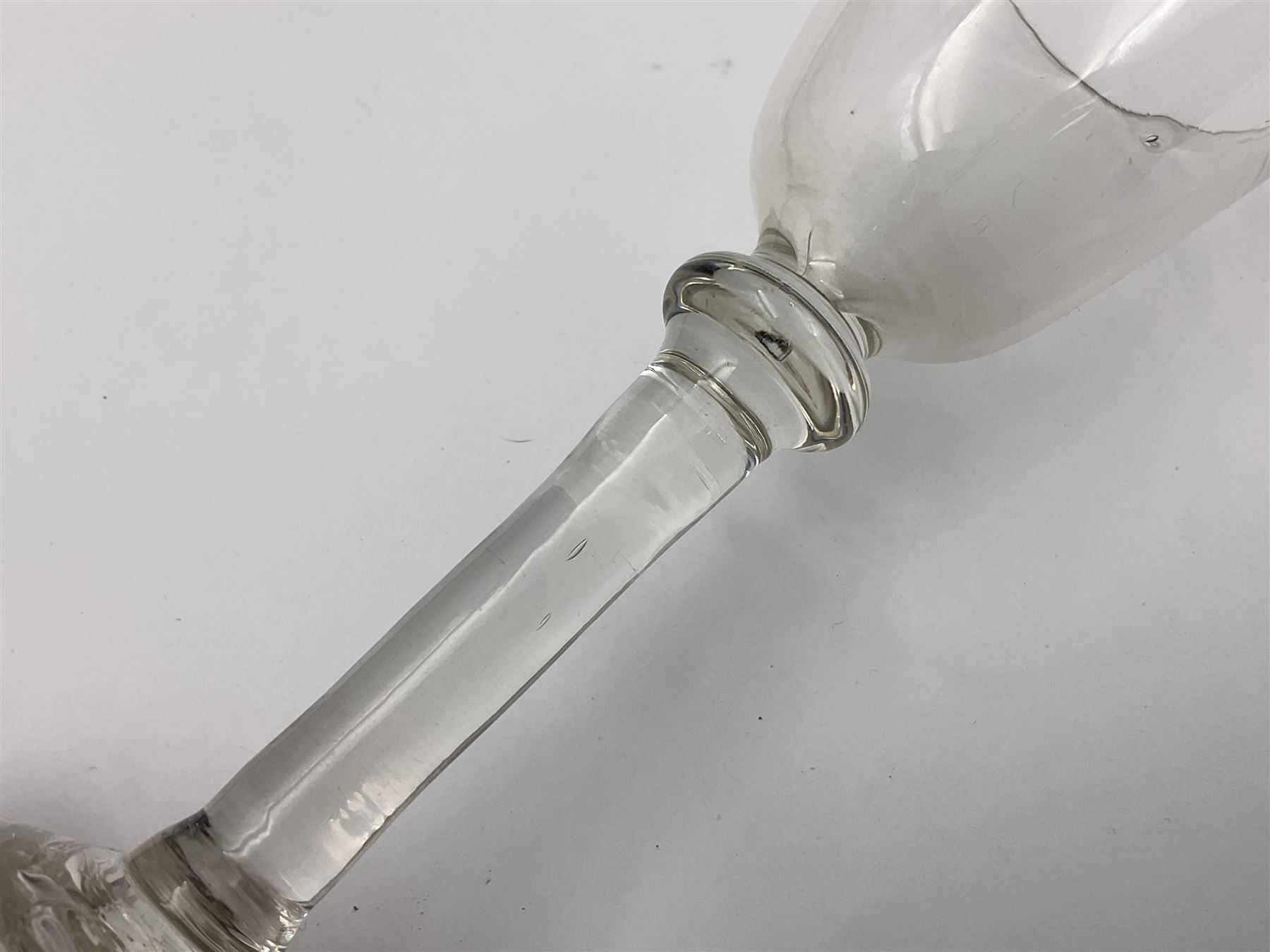 18th century wine glass, the trumpet shaped bowl upon tear drop stem and conical folded foot, H15.5cm, together with an 18th century cordial glass, the round funnel bowl on plain knopped stem and folded conical foot