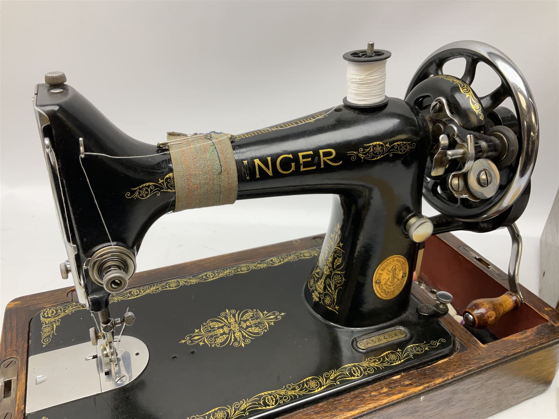 Singer sewing machine no. EA584046 in case (missing key) and Singer Manual of Family Sewing Machines
