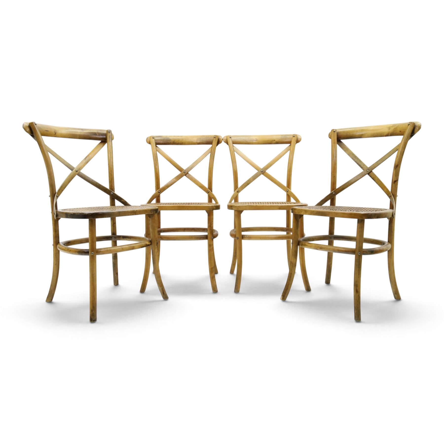 Set of four Oka style rattan dining chairs, bentwood frames inset rattan seat