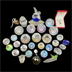 Swarovski Crystal paperweights, to include a globe with dove to the top, pyramid shapes etc, together with a large collection of boxes and stands  