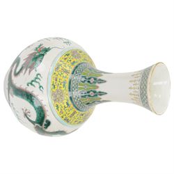 Pair 20th century Chinese famille verte bottle vases, each decorated with green and purple dragons chasing pearls amidst auspicious flames, the neck with yellow and green stylised foliate and cell borders, and the white glazed body incised throughout with fan shapes, each with red character mark beneath flanked by green dragons, H38cm

