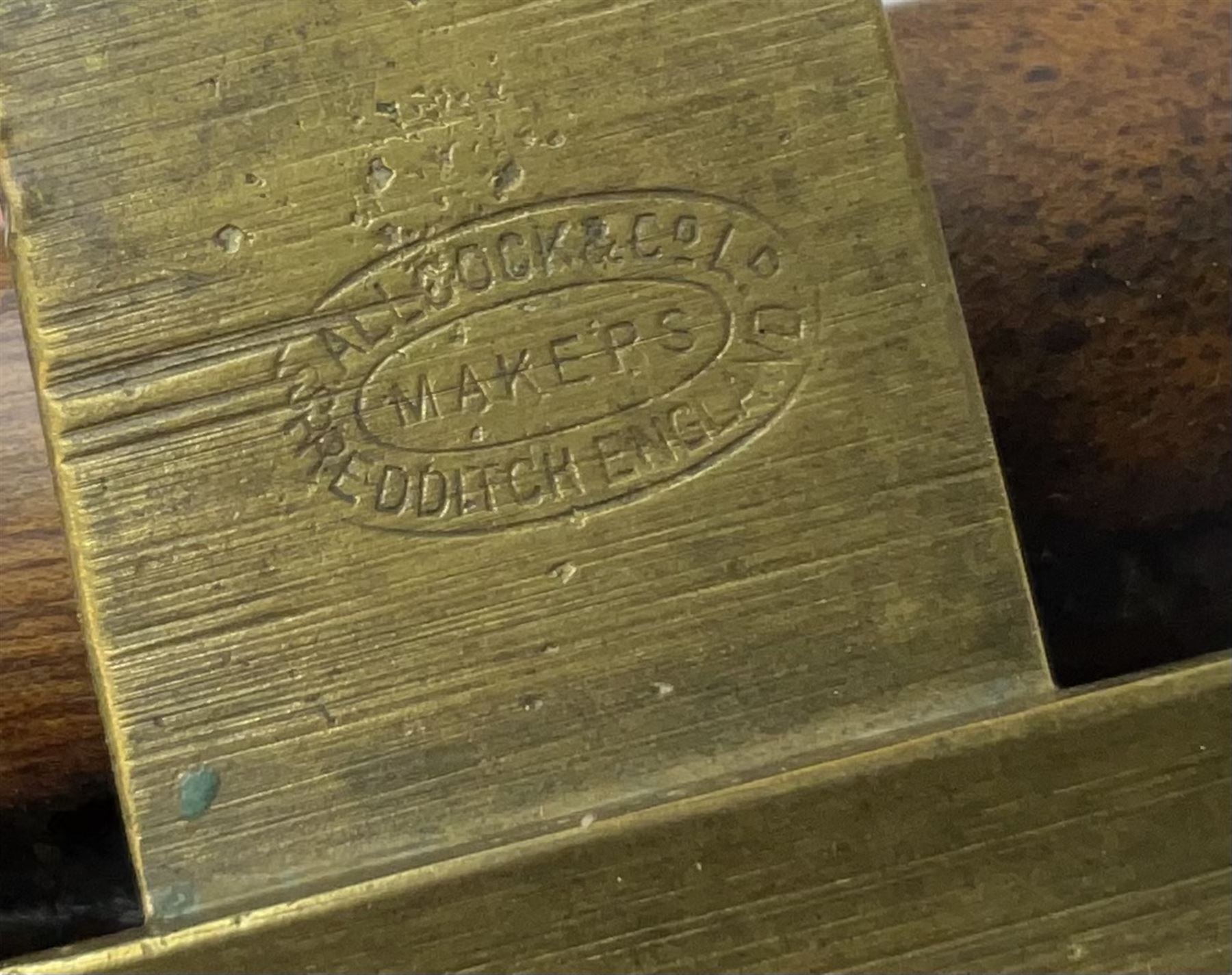 Three Allcocks & Co Ltd reels of brass and wood construction, the largest D4.5 inches