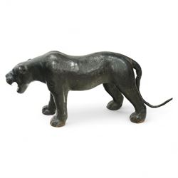 Early 20th century leather-covered decorative model of a Panther in a naturalistic stance, prowling forward with arched back, lowered head, and extended tail, open jaws revealing teeth and fangs with nylon whiskers