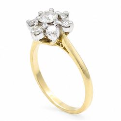 18ct gold diamond flower head cluster ring, principal round cut diamond of approx 0.55 carat, surrounded by six round brilliant cut diamonds, hallmarked, total diamond weight 1.15 carat